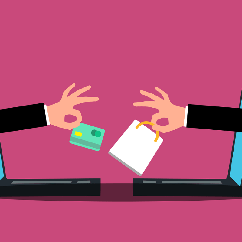 Graphic of two hands reaching out of opposite laptops exchanging a shopping bag and a credit card, online shopping and marketplaces