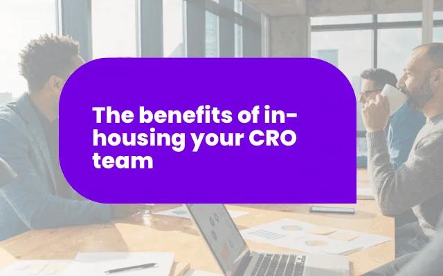 Business team in a meeting room discussing the benefits of in-housing a CRO team, relevant to best Facebook ads strategies.