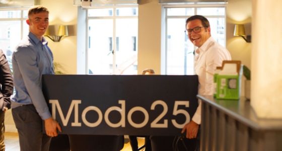 John and John and Modo25 sign