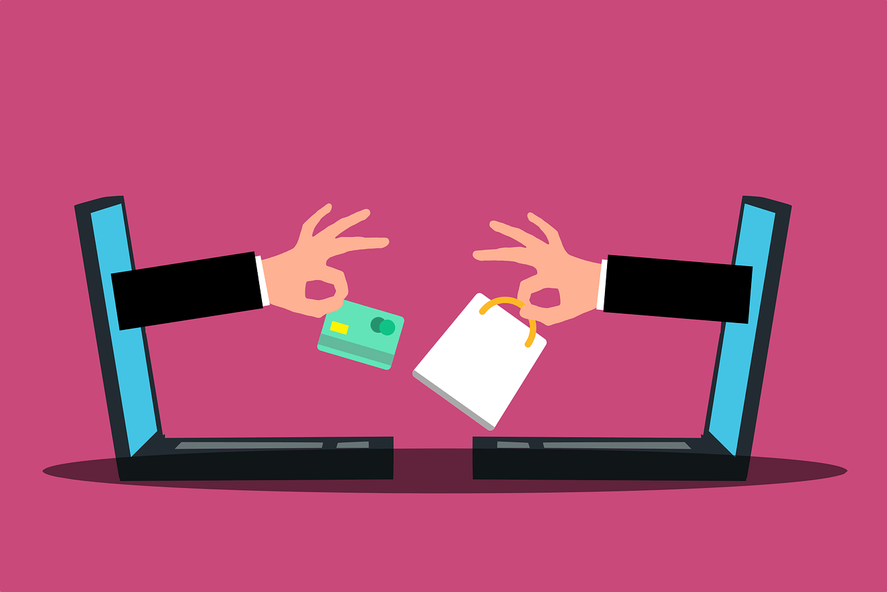 Graphic of two hands reaching out of opposite laptops exchanging a shopping bag and a credit card, online shopping